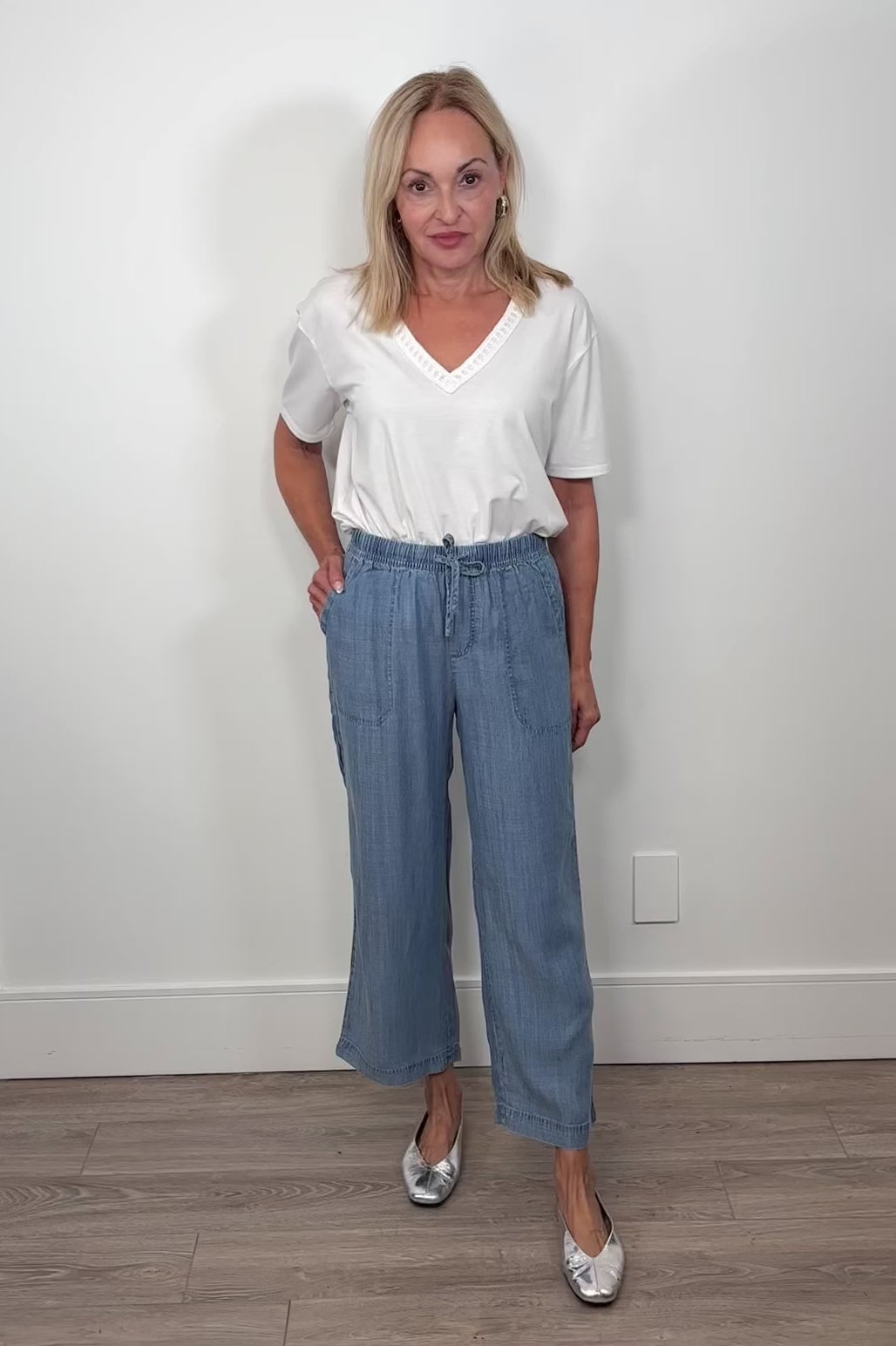 Video of breathable blue pants with an elastic waistband 