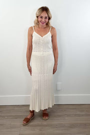 video of woman wearing a cream knit midi skirt with elastic waistband