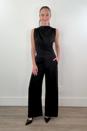 video of woman wearing stretch satin pants in black