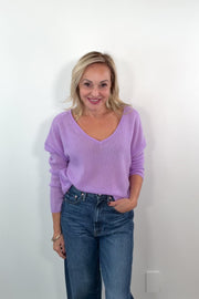 video of a woman wearing a cashmere lilac oversized reversible sweater