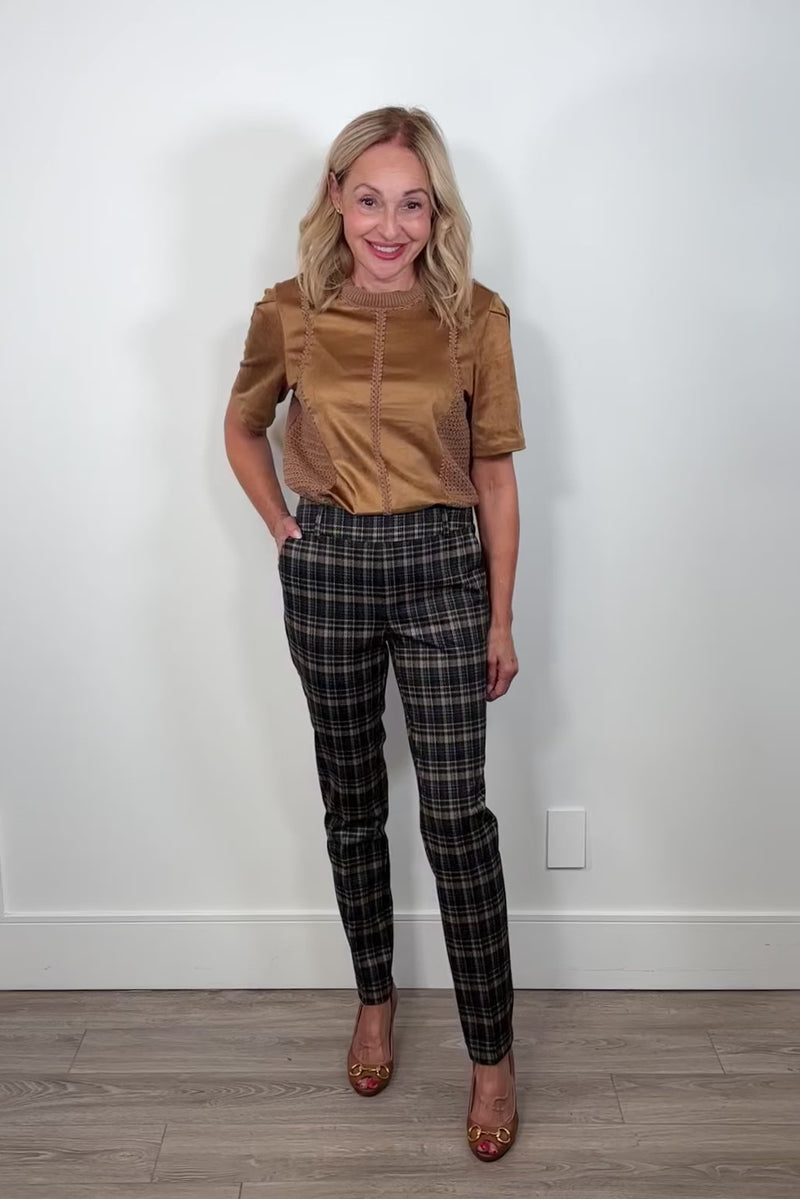Video of a woman wearing plaid pants