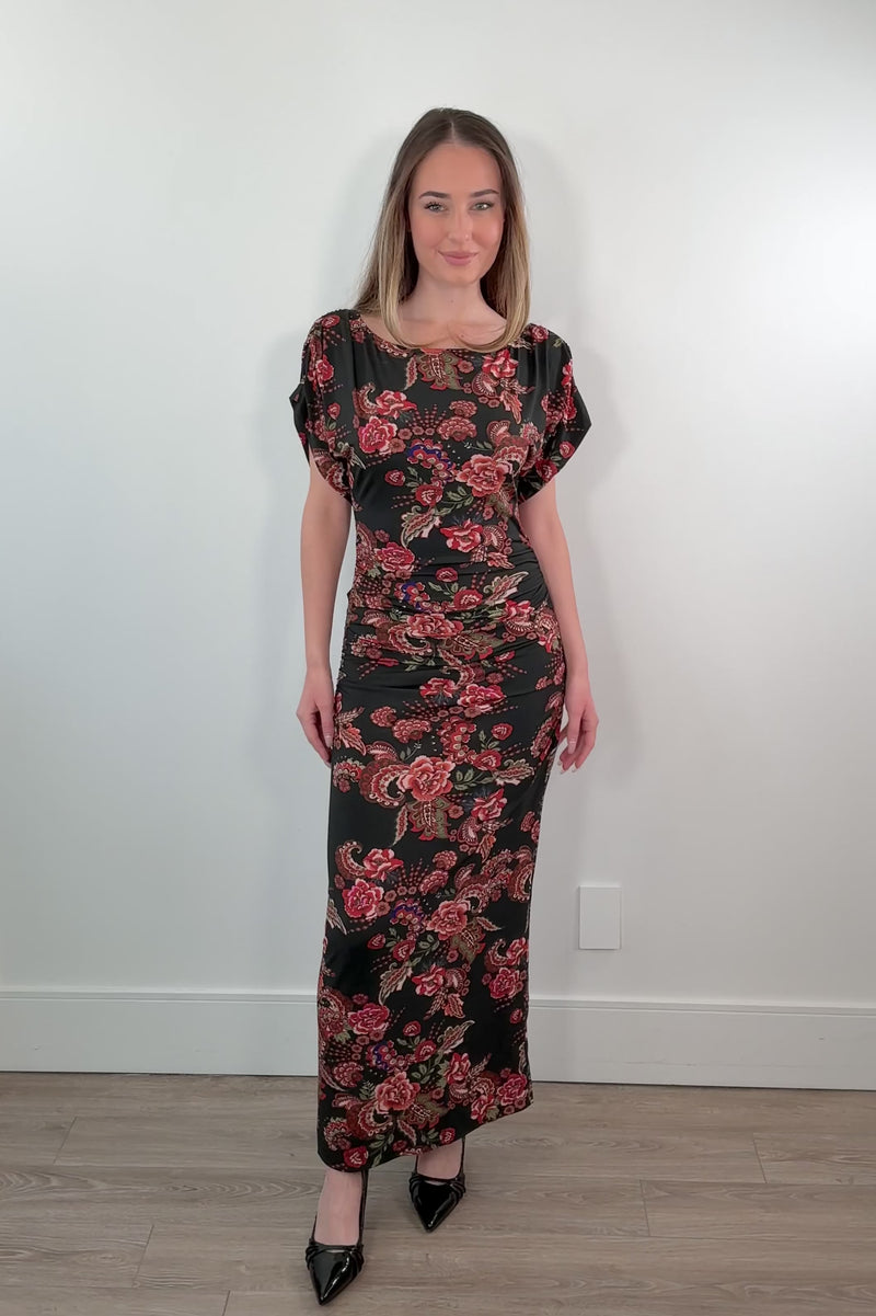 video of a woman wearing a maxi rouched floral dress 