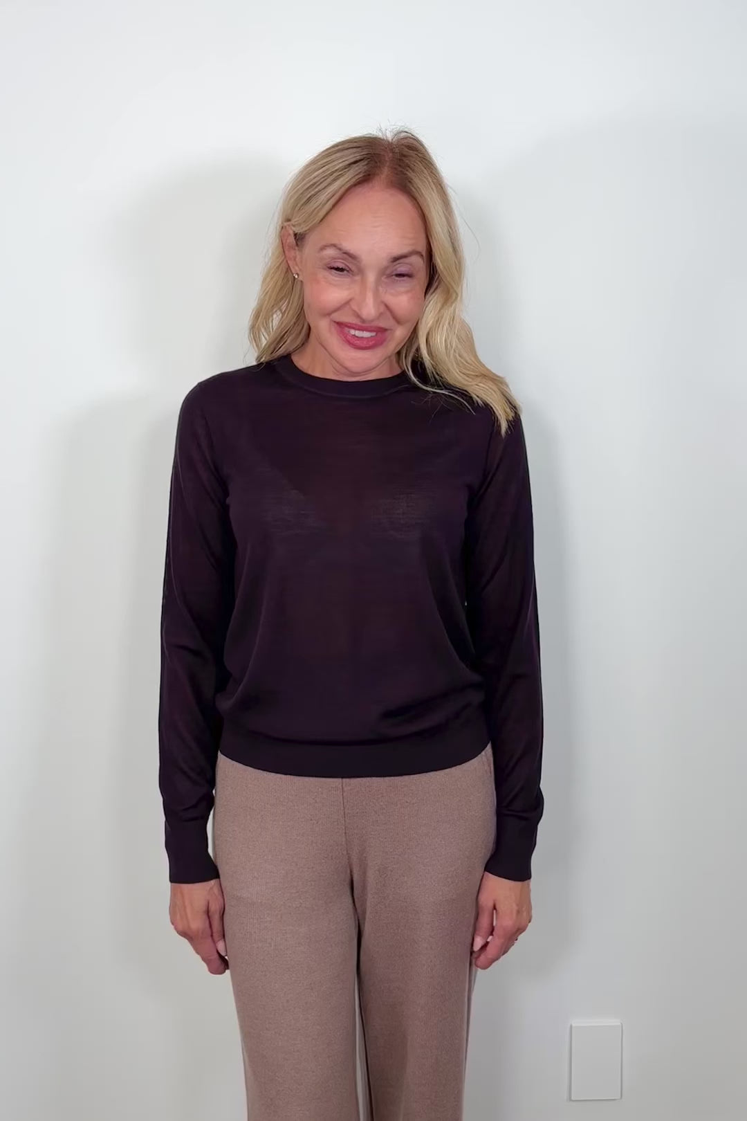 Video of a woman wearing a fine merino crew neck
