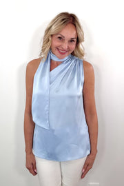 Video of Woman wearing a scarf blouse in light blue