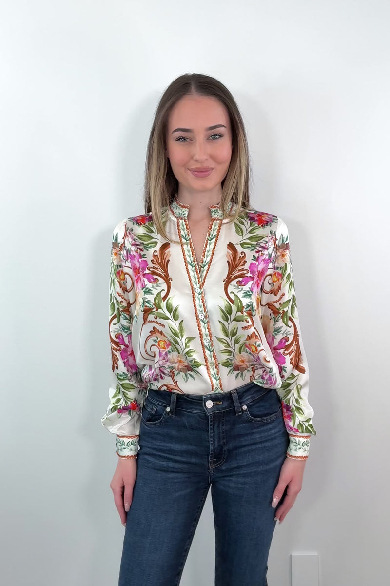 video of a woman wearing an ivory regency printed button down shirt tucked in