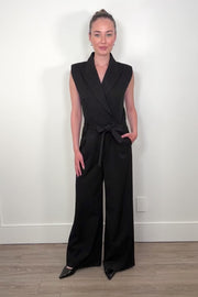 Video of woman wearing a black pinstriped jumpsuit with sparkle embelishment