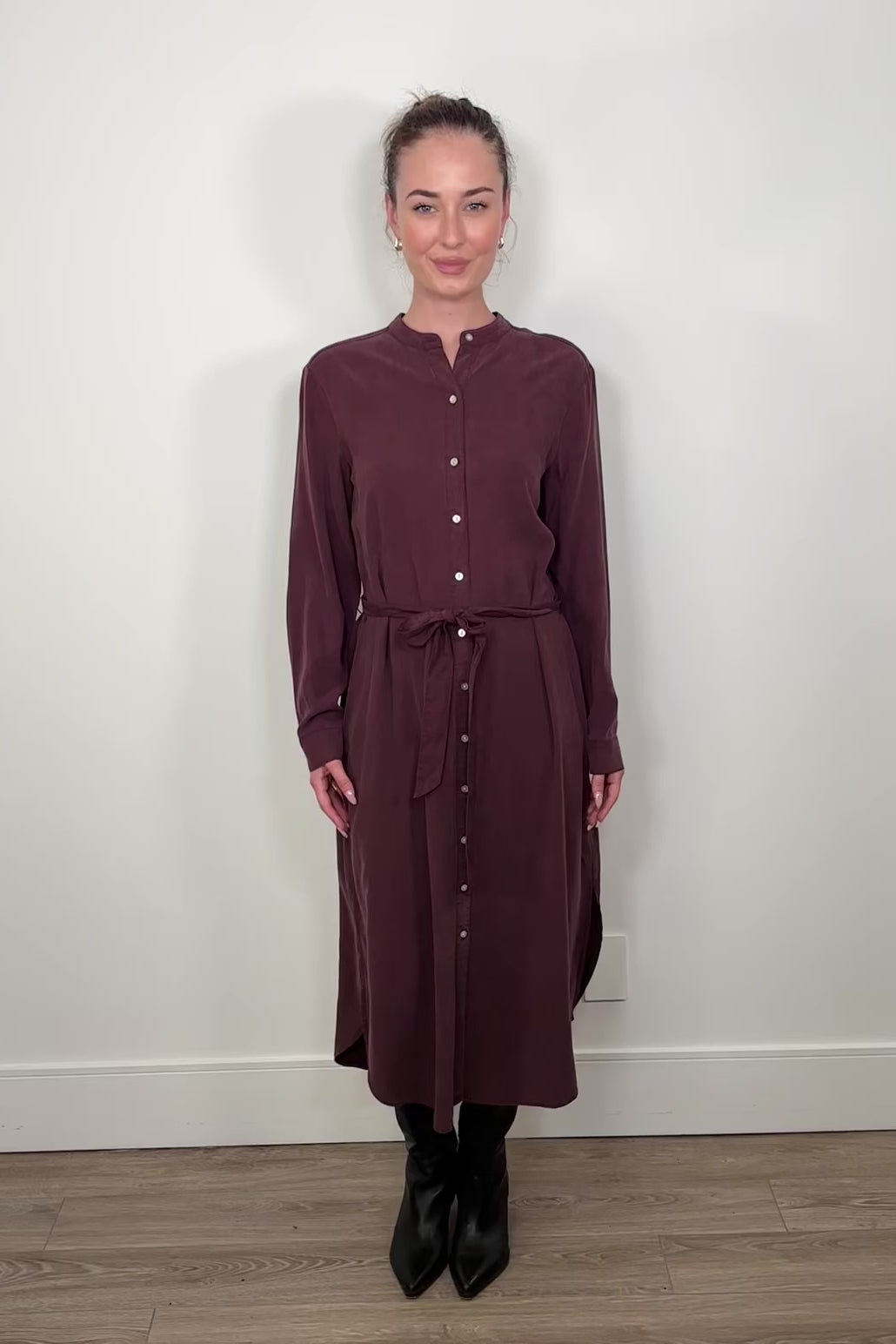Video a woman wearing a maxi long sleeve button down shirt dress