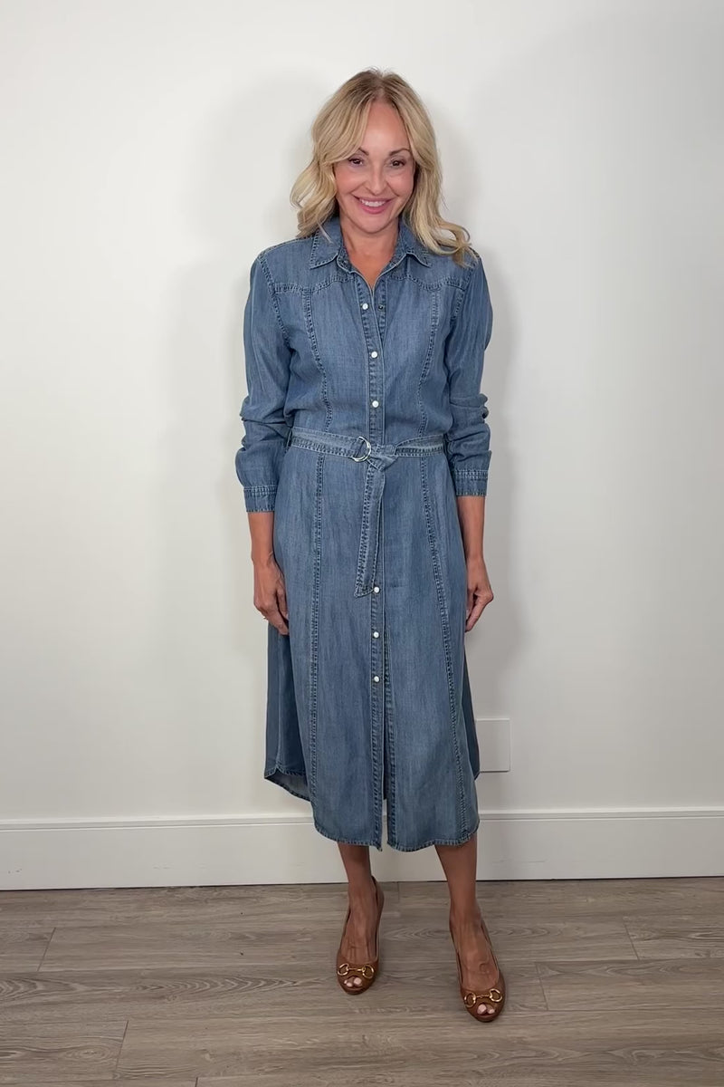 Video of woman wearing a blue denim tencel button up dress
