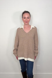 Video of woman wearing a cool beige white- collar sweater