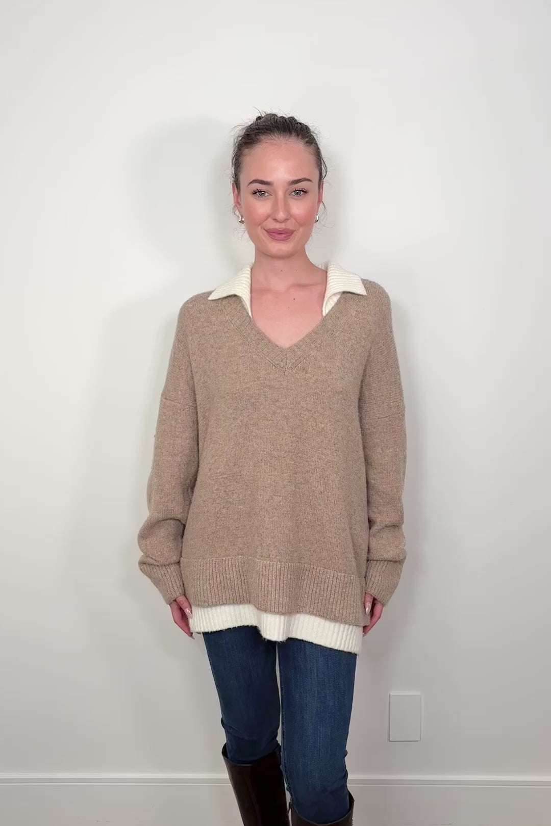 Video of woman wearing a cool beige white- collar sweater