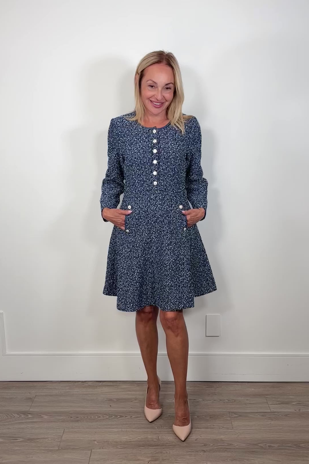 Video of woman wearing a blue tweed short dress