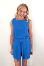 Video of woman wearing blue vegan silk sleeveless top