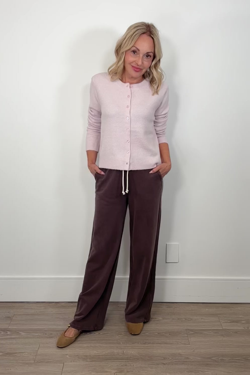 video of a p erson wearing brown wide-leg brown knit pants