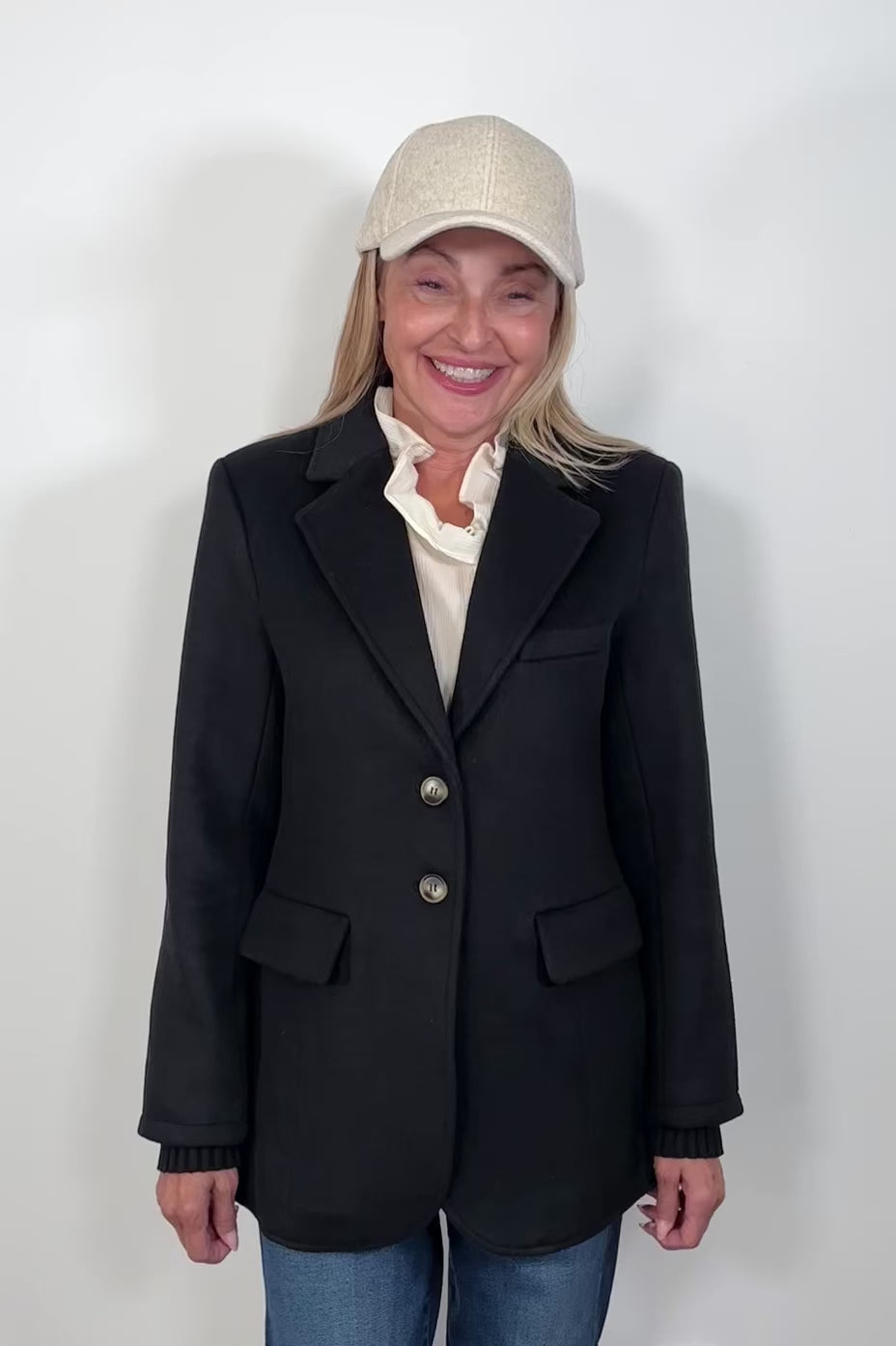 video of a woman wearing a black blazer