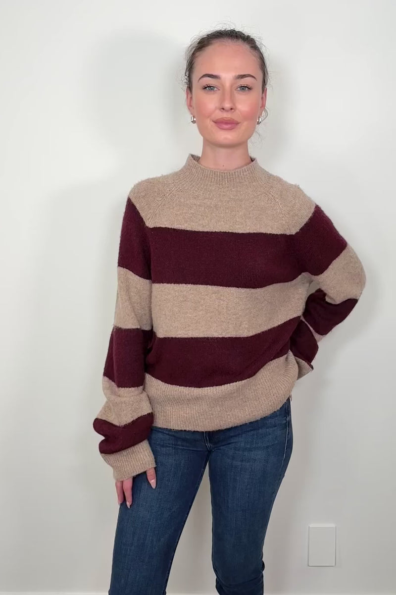 Video of a woman wearing a Sweater with burgundy stripes 
