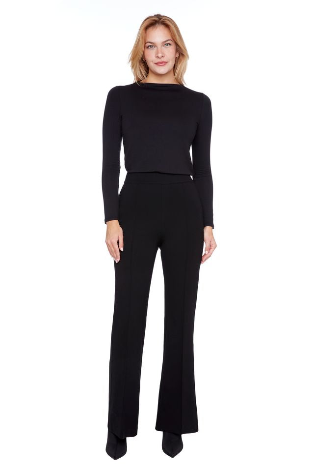 Woman wearing a black outfit on a white background