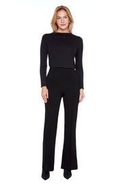 Woman wearing a black outfit on a white background