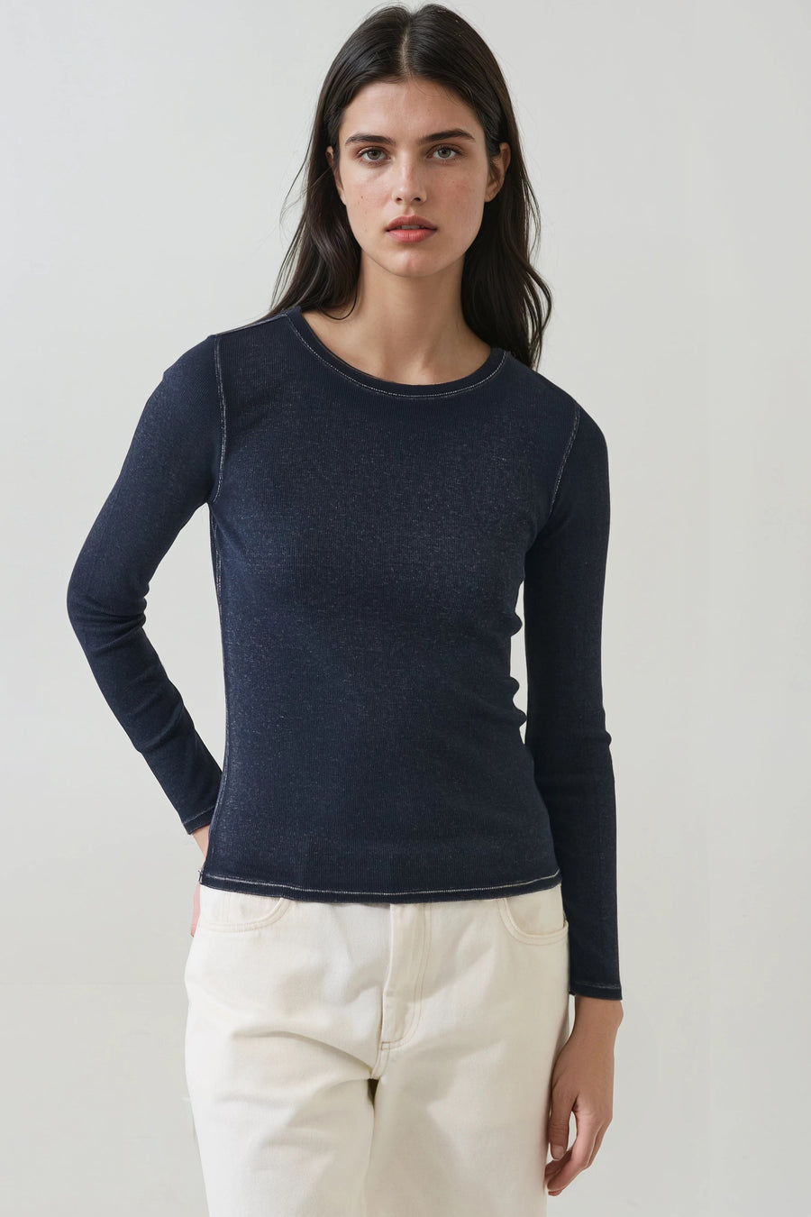 model wearing long sleeve navy long sleeve top with white stitching 