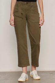 Woman wearing olive green cropped utility pants with a relaxed straight-leg silhouette. Features a high-rise waist, button and zip closure, oversized front patch pockets, and utility-inspired seam detailing. Crafted from soft stretch twill for everyday comfort and ease of movement, front