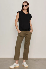 Woman wearing olive green cropped utility pants with a relaxed straight-leg silhouette. Features a high-rise waist, button and zip closure, oversized front patch pockets, and utility-inspired seam detailing. Crafted from soft stretch twill for everyday comfort and ease of movement, front