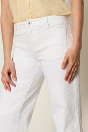 Woman wearing white high-waisted cropped straight-leg pants, detail