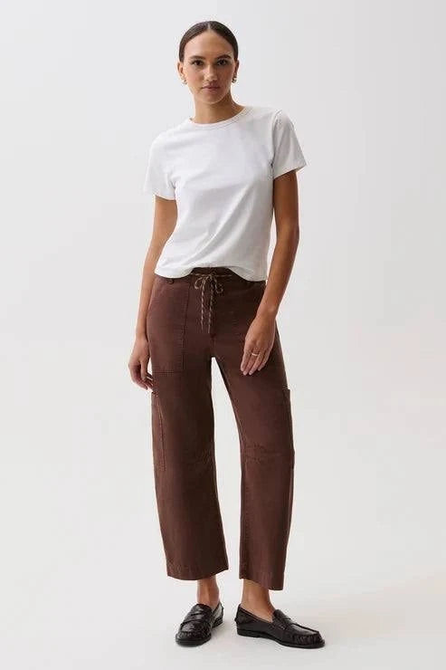 woman wearing brown straight leg pants