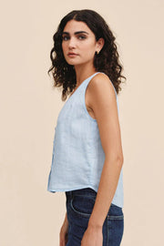 Light blue sleeveless V-neck top with front button detail and relaxed fit, side