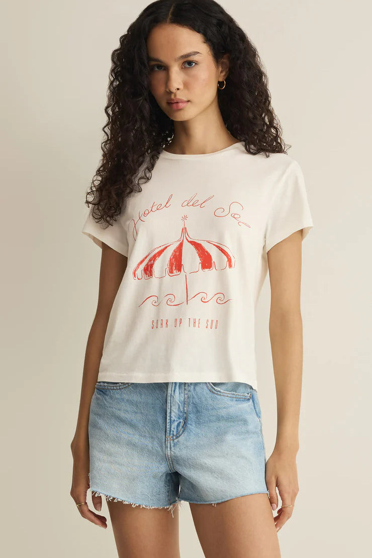 Woman wearing a white short-sleeve graphic T-shirt with red print, front