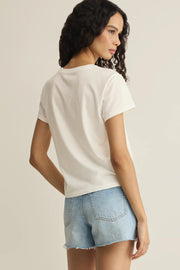 Woman wearing a white short-sleeve graphic T-shirt with red print, back