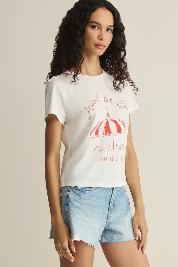 Woman wearing a white short-sleeve graphic T-shirt with red print, front