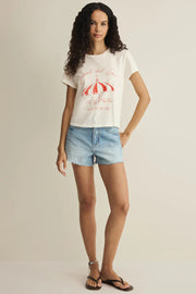 Woman wearing a white short-sleeve graphic T-shirt with red print, front