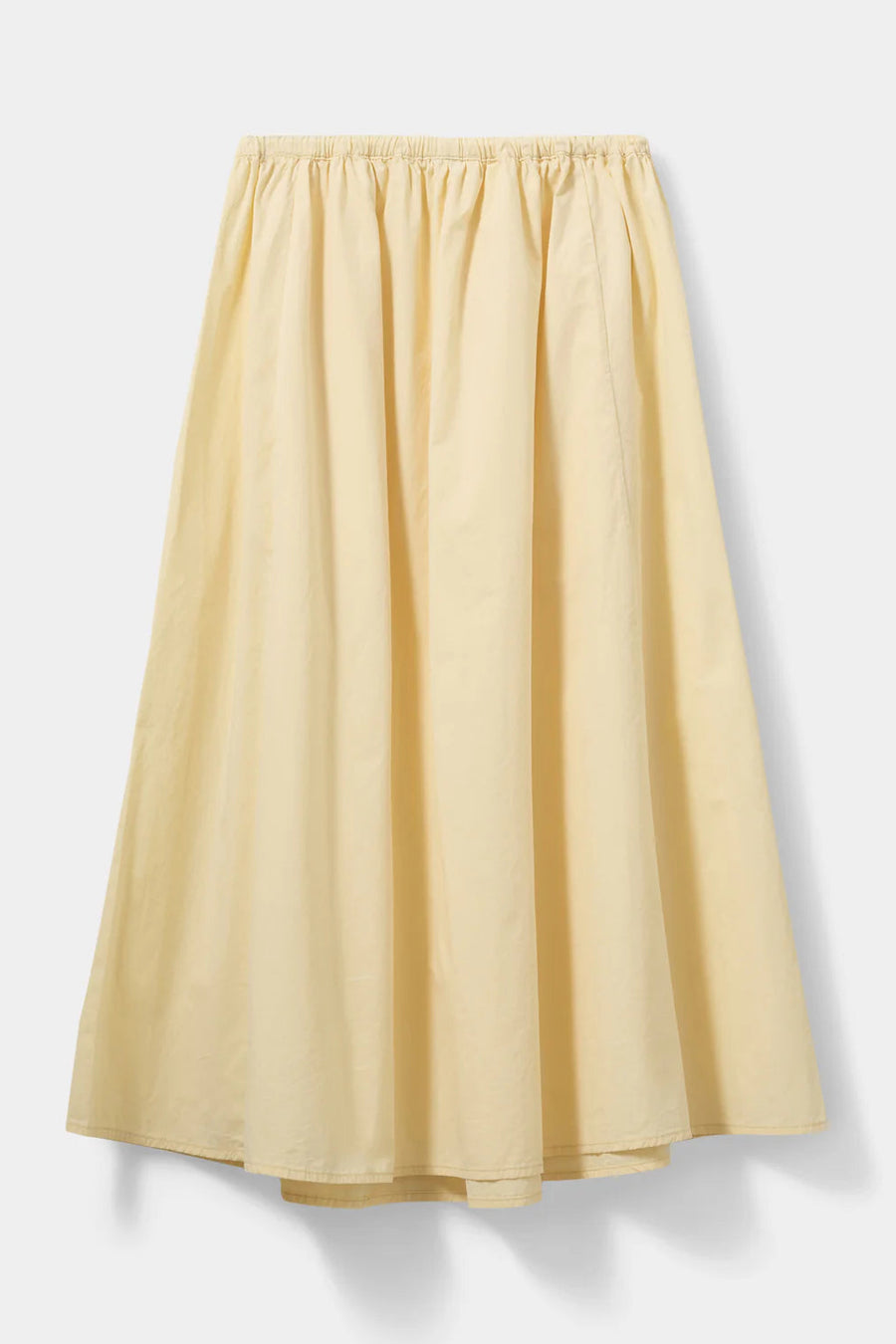 Woman wearing a pale yellow elastic-waist midi skirt with a drawstring, back