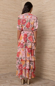 Woman wearing a floral dress.