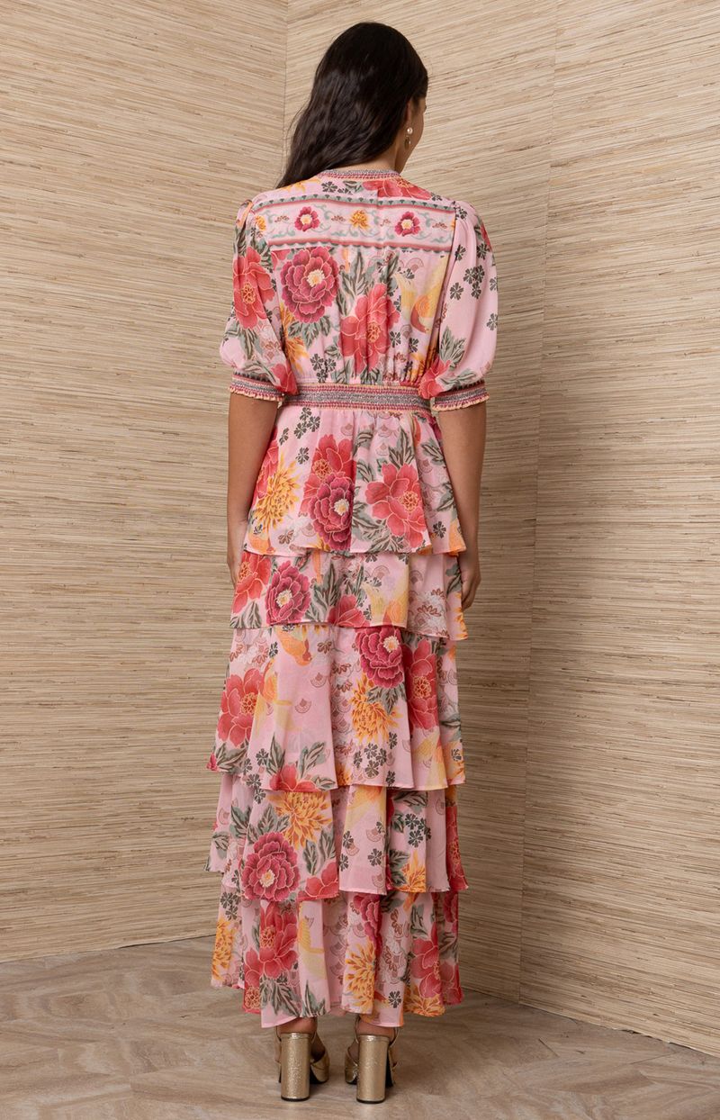 Woman wearing a floral dress.
