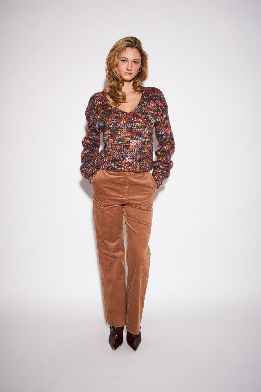 womens v neck sweater, with orange, red, grey and green blended together 