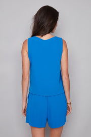 woman wearing blue vegan silk sleeveless top