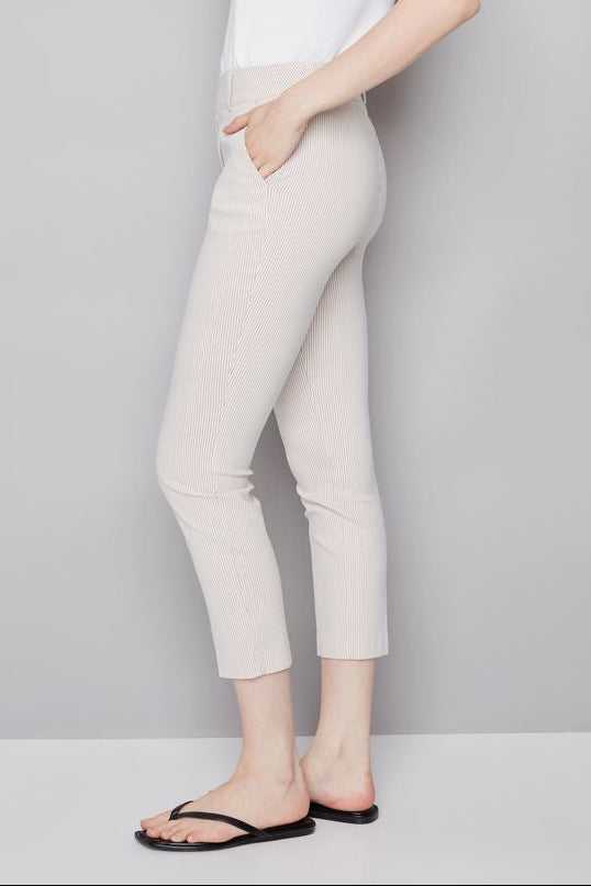 woman wearing an ankle length beige stripped pants