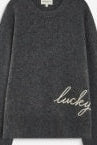 A dark gray long-sleeve crewneck sweater with 'lucky' embroidered in white script across the lower right chest, displayed on a clean white background.