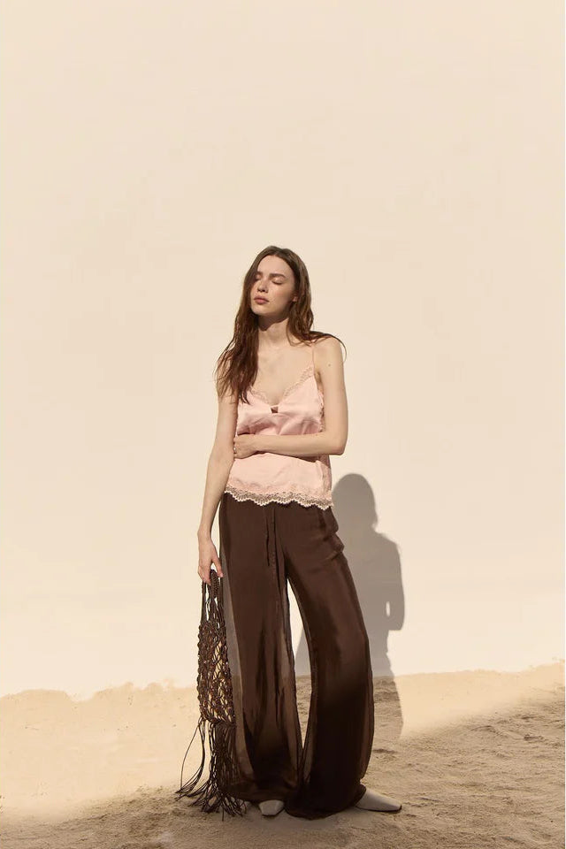 woman wearing dark brown wide leg flowy pants