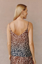 Back view of a woman wearing a rayon v-neck leopard print cami