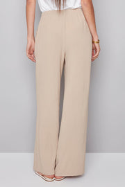 woman wearing a beige drawstring pant