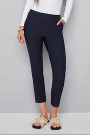 woman wearing a navy blue ankle pant