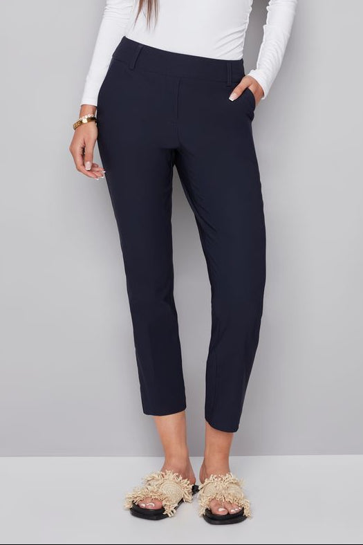 woman wearing a navy blue ankle pant