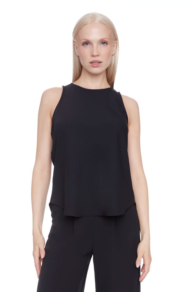 Woman wearing a black satin sleeveless top 